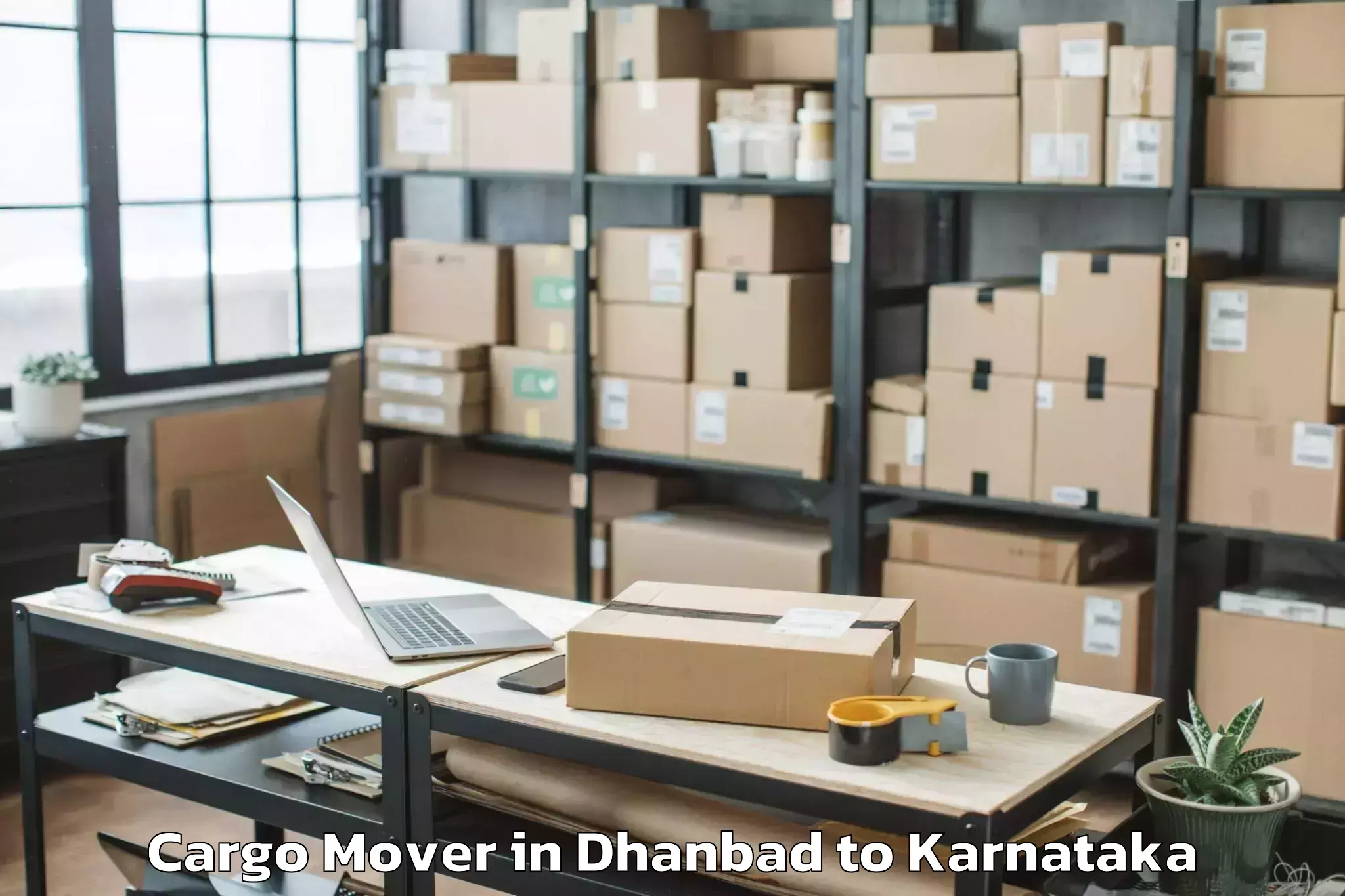 Reliable Dhanbad to Karnataka State Law University Cargo Mover